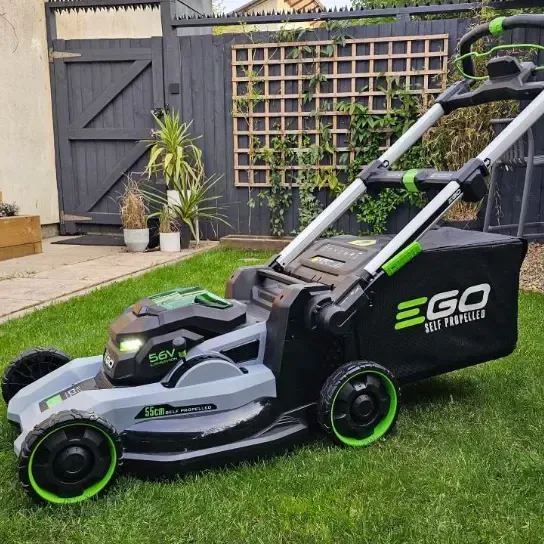 Battery-powered electric lawn mower used for quiet, zero-emission lawn care
